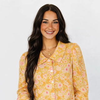 Oversized Peter Pan collar with colorful, high-density floral embroidery.