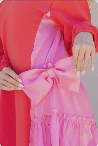  mixed media mini dress. This comfortable A-line sweatshirt style features a dramatic taffeta bow accent, ribbed trim, and stretch knit fabric for a perfect fit.