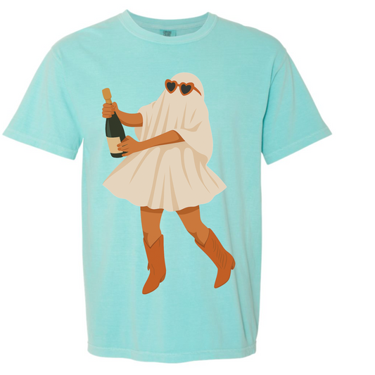 Mint green comfort colors halloween tshirt with ghost girl in orange heart sunglasses and cowboy boots holding a bottle of champagne