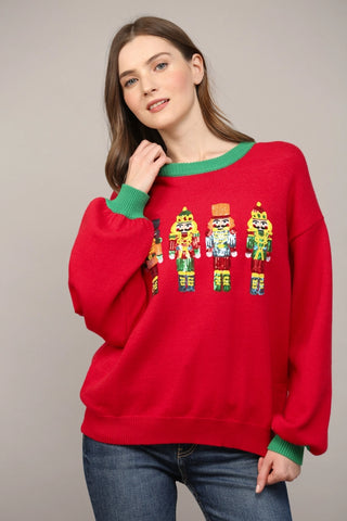 Step into the season with our dazzling Sequin Embellished Nutcracker Sweater! This merry knit features a charming nutcracker design, brought to life with sparkling sequins. The ultra-soft blend of 53% Rayon, 32% Polyester, and 15% Nylon ensures lightweight warmth and comfort for all your holiday parties and